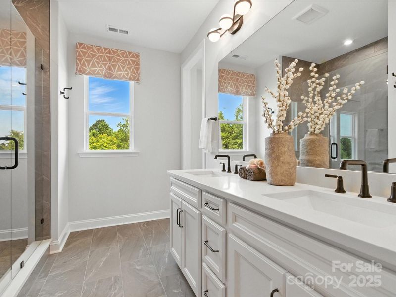 Dual Vanity and Bright Window at Primary Bath. *Model Photos | Actual Finishes, Structural Selections, and Orientation May Vary.