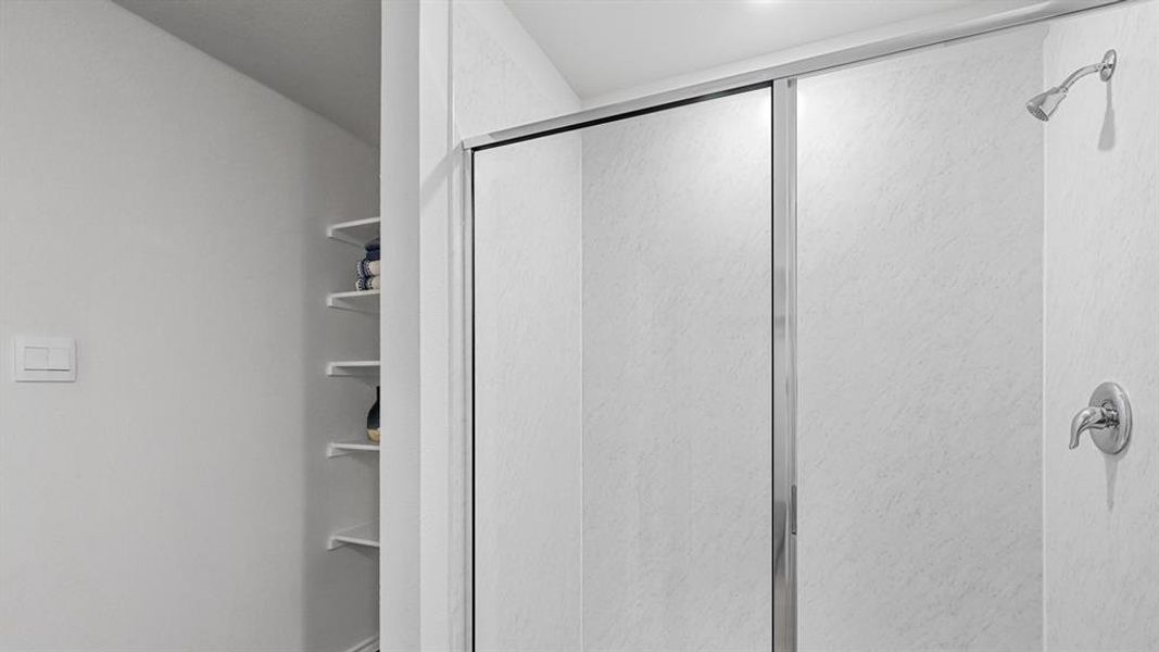 Full bathroom with a shower stall Full bathroom with a shower stall