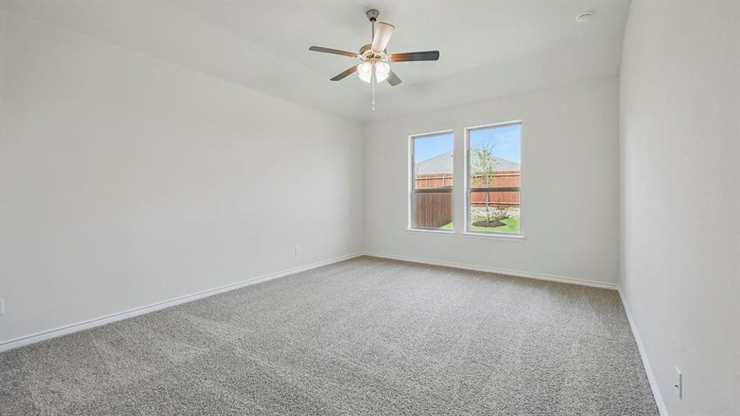 Unfurnished room with carpet and ceiling fan