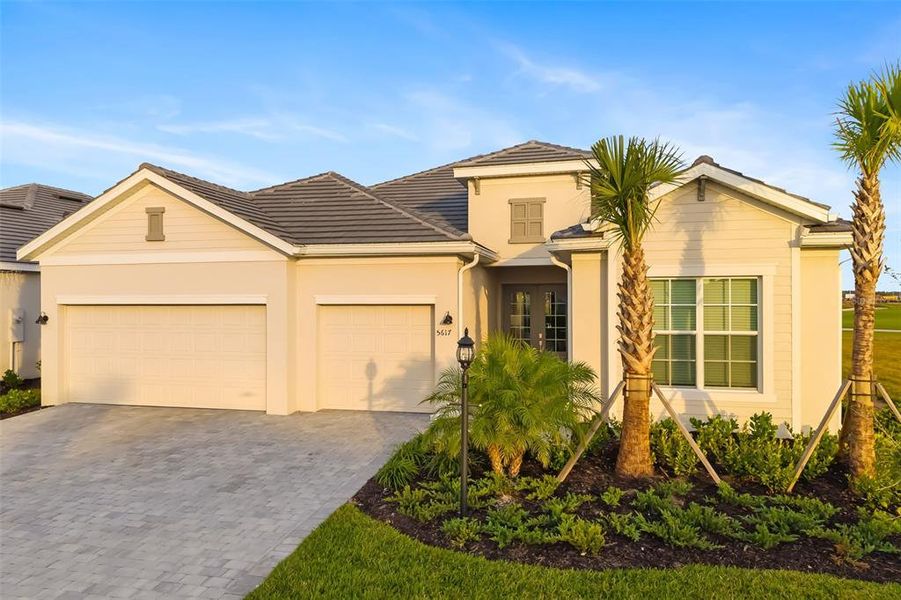 Front exterior of a new home in , Lakewood Ranch, FL, highlighting curb appeal (Image 25).