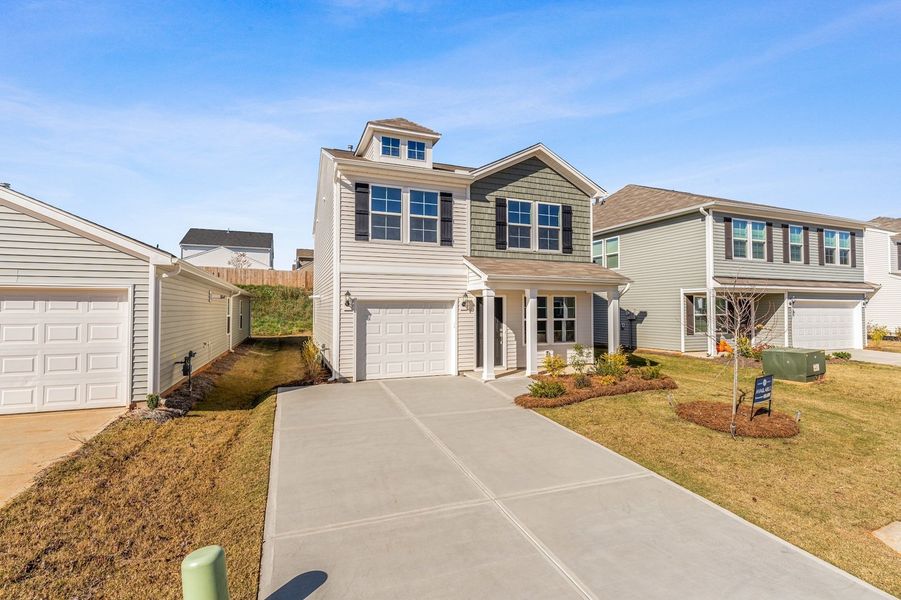 Front exterior of a new home in Wingate, Inman, SC, highlighting curb appeal (Image 19).