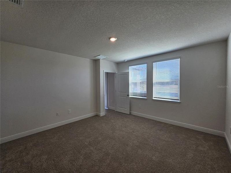 Spacious, unfurnished interior of a new home in The Reserve at Hammock Oaks - Classic Series, Lady Lake (Image 37).