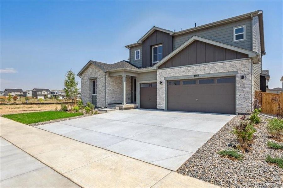 Front exterior of a new home in Prestige Collection at Parkdale Commons, Lafayette, CO, highlighting curb appeal (Image 18). Front exterior of a new home in Prestige Collection at Parkdale Commons, Lafayette, CO, highlighting curb appeal (Image 18).