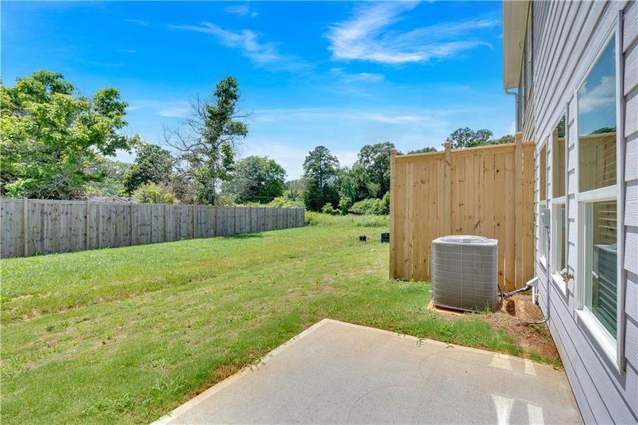 Exterior details and patio area of a home in Village Green, Adairsville (Image 4).