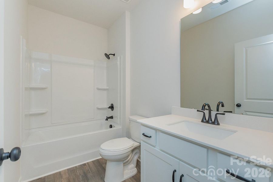 Furnished interior view inside a new home in Country Club Village, Salisbury (Image 10).