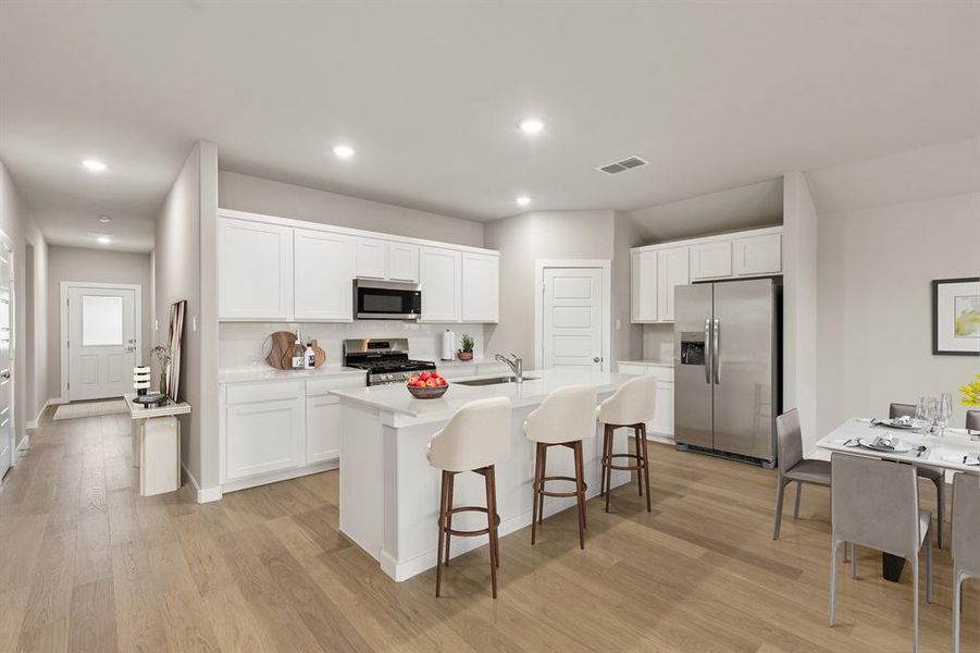 Kitchen in the Emmy II home plan by Trophy Signature Homes - REPRESENTATIVE PHOTO