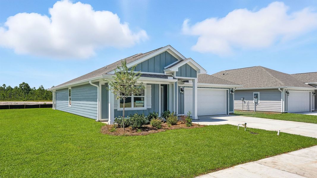 Front exterior of a new home in Palmetto Bluff, Port Saint Joe, FL, highlighting curb appeal (Image 2). Front exterior of a new home in Palmetto Bluff, Port Saint Joe, FL, highlighting curb appeal (Image 2).