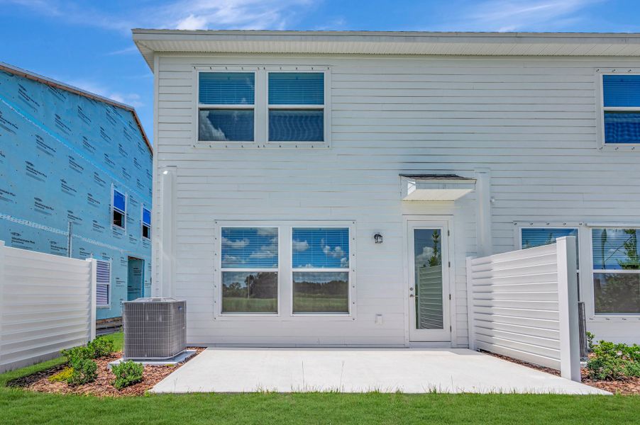 Exterior details and patio area of a home in Waterset Townhomes, Apollo Beach (Image 3).