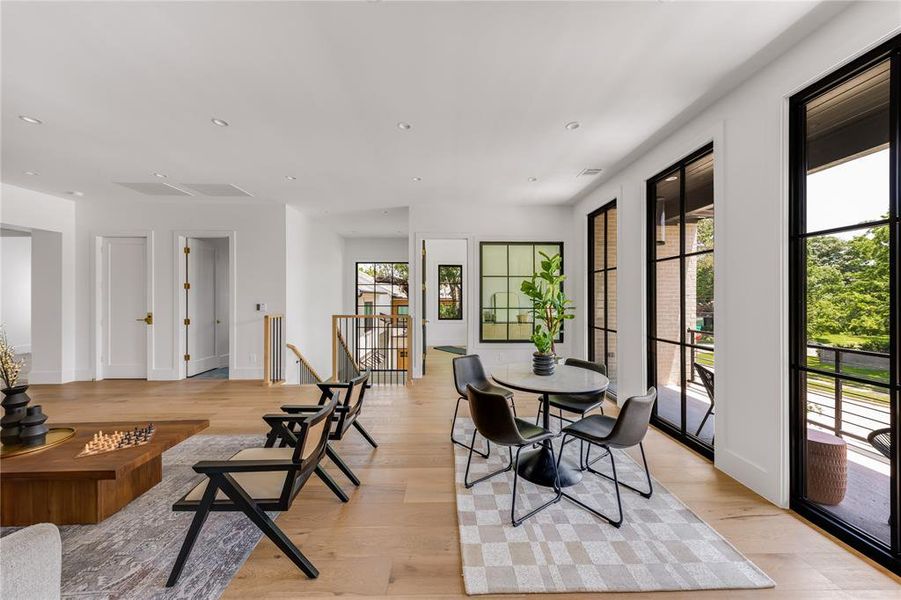 Dining space with light wood-type flooring and plenty of natural light