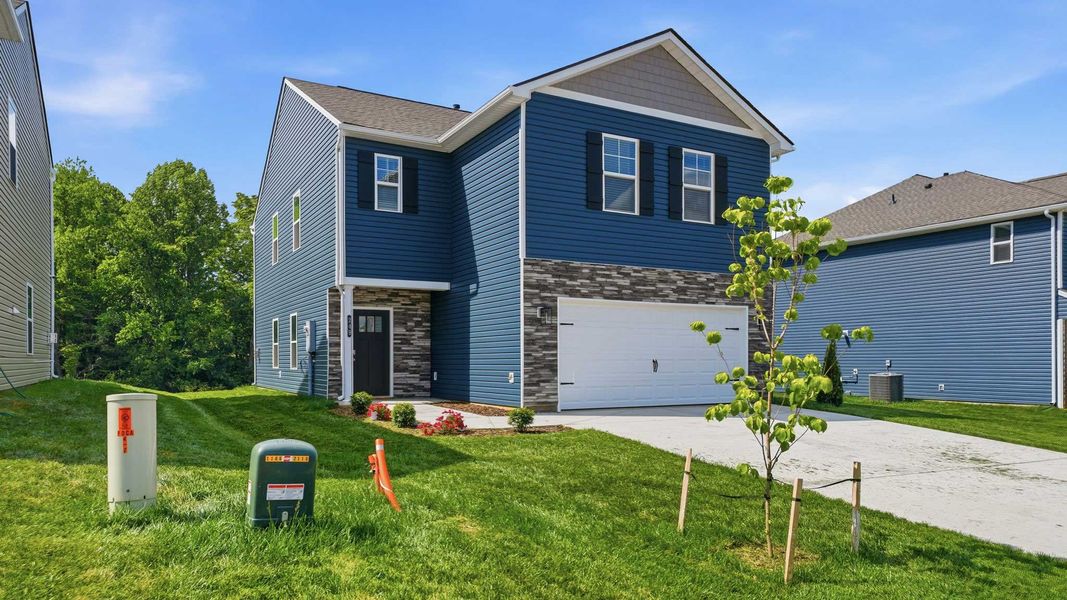 Front exterior of a new home in Fieldcrest Acres, Blountville, TN, highlighting curb appeal (Image 20). Front exterior of a new home in Fieldcrest Acres, Blountville, TN, highlighting curb appeal (Image 20).
