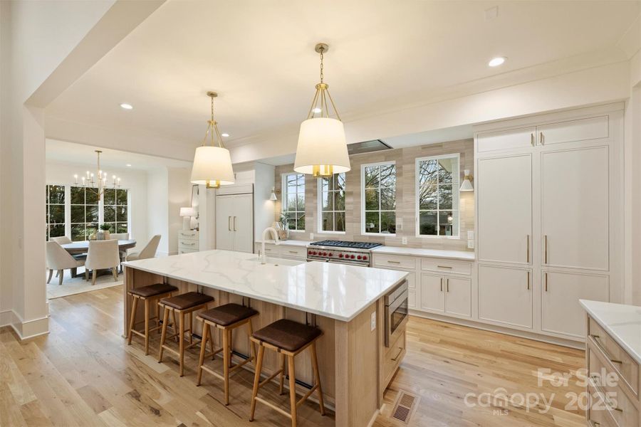 Custom, solid white oak, inset cabinetry speaks to the true craftmanship displayed throughout the home.