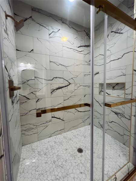 Full bathroom with a marble finish shower Full bathroom with a marble finish shower