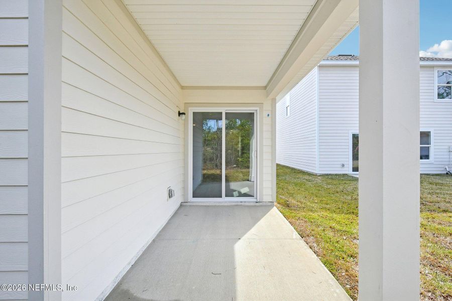 Exterior details and patio area of a home in Kings Landing, Jacksonville (Image 9).