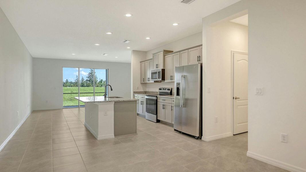 Furnished interior view inside a new home in Palm Grove Real Estate and Homes for Sale in Lakewood Ranch, FL - Neal Communities, Lakewood Ranch (Image 7).