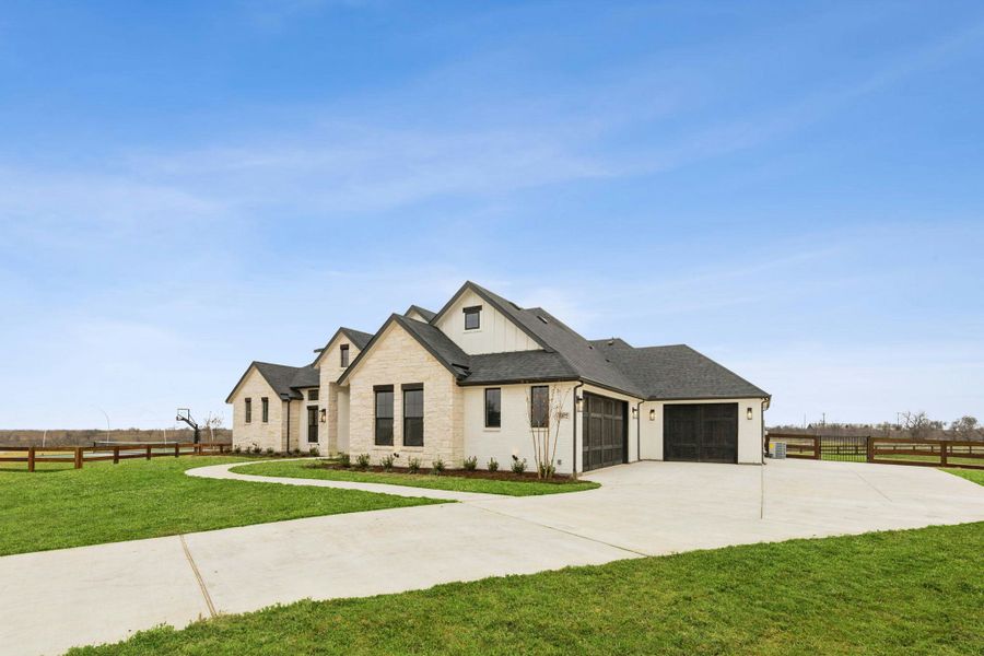 Front exterior of a new home in The Vines, Haslet, TX, highlighting curb appeal (Image 20).