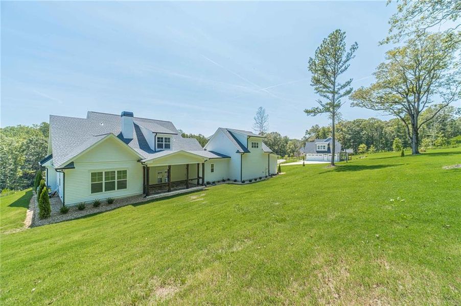 Front exterior of a new home in , Dacula, GA, highlighting curb appeal (Image 28).