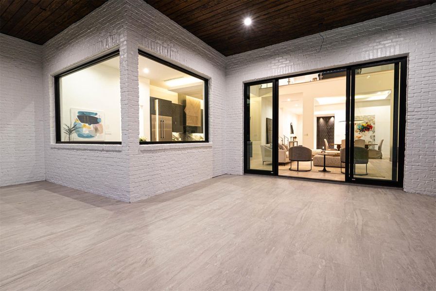 Outdoor living space features a 12-foot  sliding glass doors.