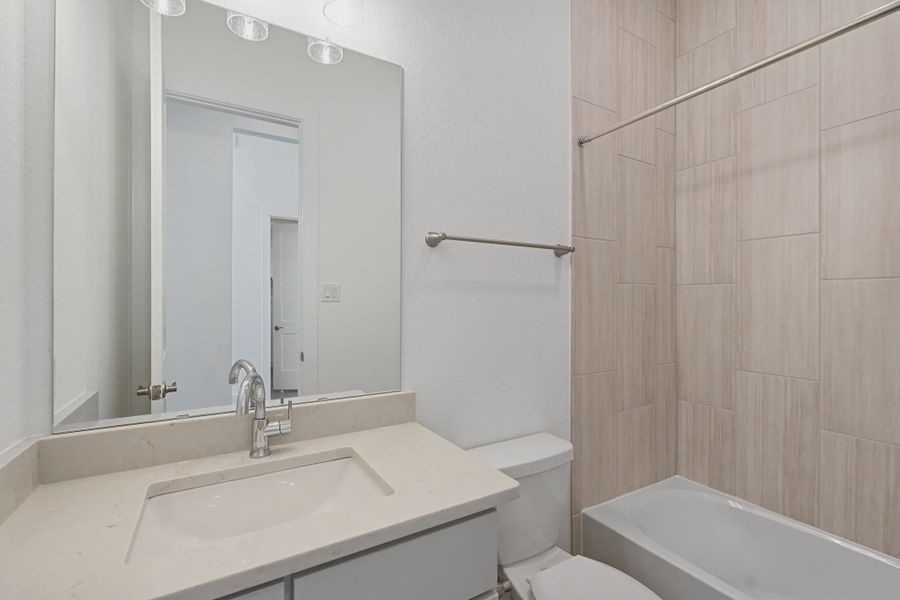 Representative furnished interior of a home built from the Brentwood by Chesmar Homes in Meridiana 50's and 60's, Manvel (Image 4).