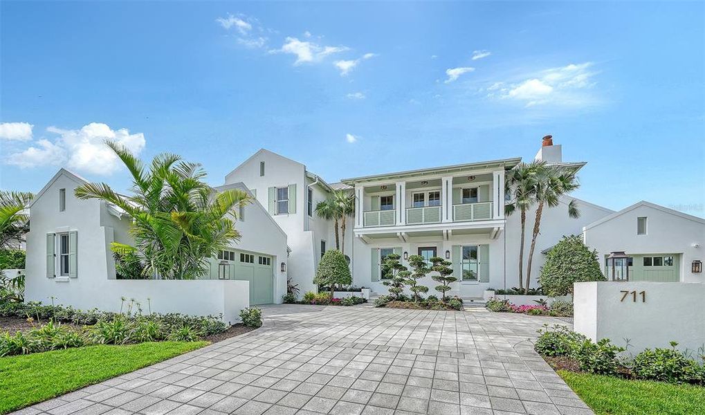 Front exterior of a new home in , Longboat Key, FL, highlighting curb appeal (Image 2). Front exterior of a new home in , Longboat Key, FL, highlighting curb appeal (Image 2).