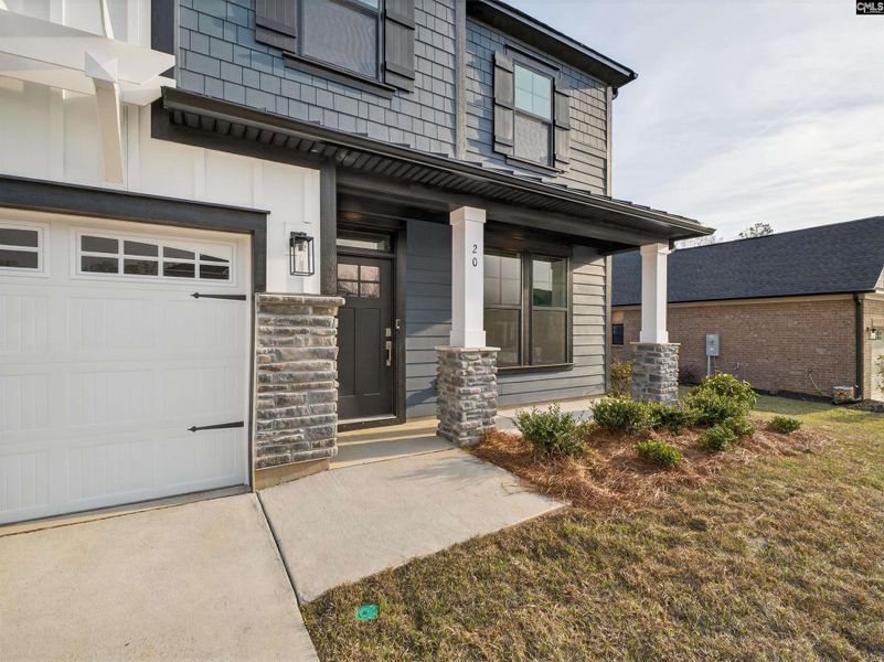 Exterior details and patio area of a home in Collins Cove, Chapin (Image 3).
