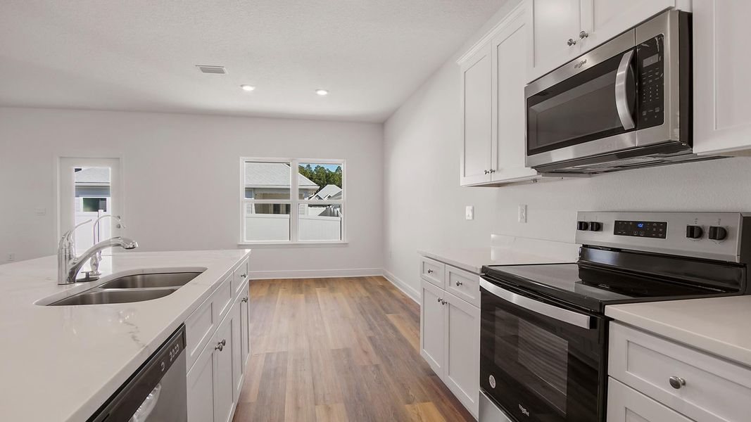 Furnished interior view inside a new home in Bayside at Ward Creek, Panama City Beach (Image 7).