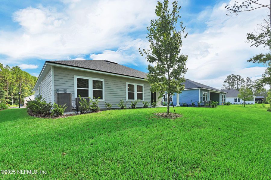 Front exterior of a new home in Trailmark - Phase 10, St. Augustine, FL, highlighting curb appeal (Image 22). Front exterior of a new home in Trailmark - Phase 10, St. Augustine, FL, highlighting curb appeal (Image 22).