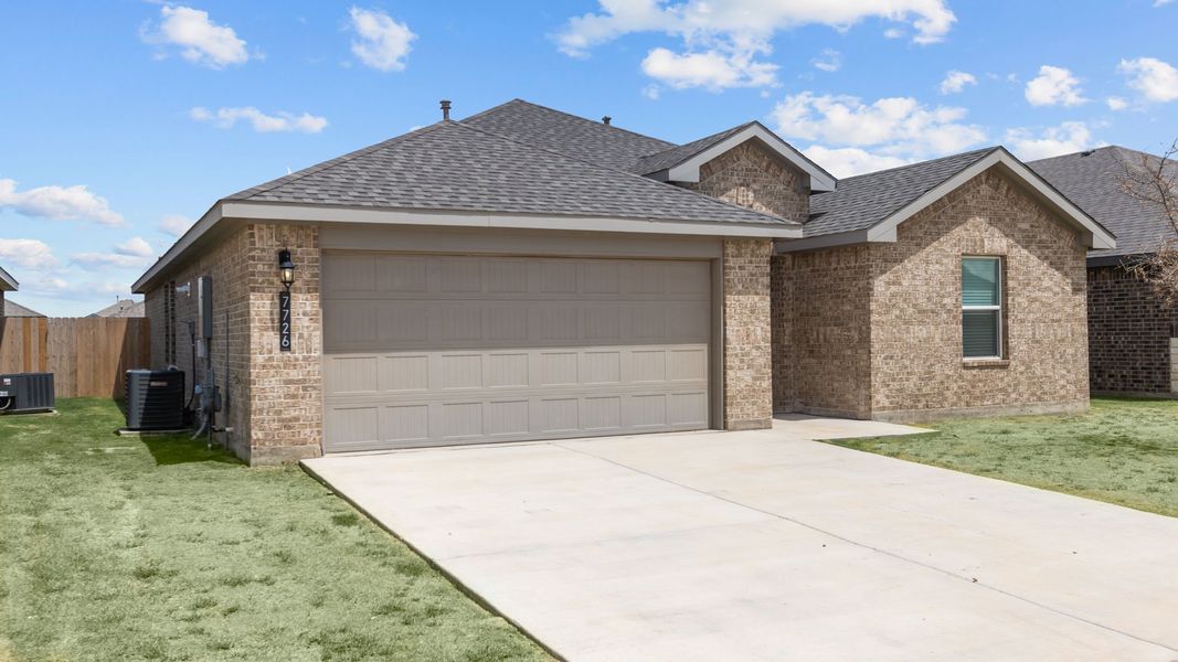 Front exterior of a new home in Everest Heights, Lubbock, TX, highlighting curb appeal (Image 2). Front exterior of a new home in Everest Heights, Lubbock, TX, highlighting curb appeal (Image 2).