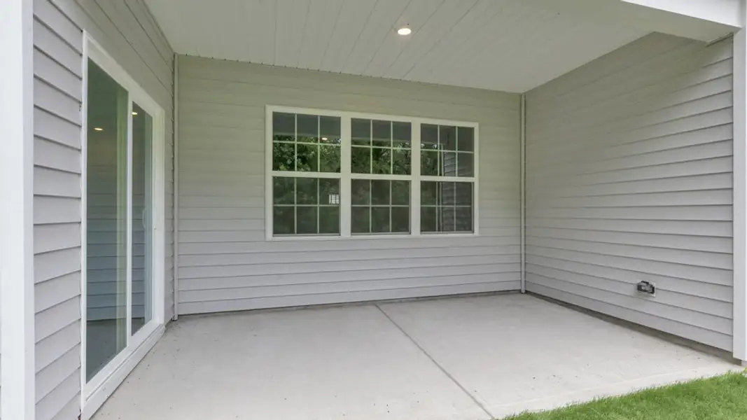 Exterior details and patio area of a home in Cross Creek, Spring Lake (Image 4).