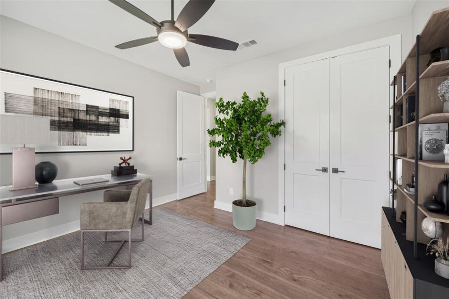 Downstairs guest bedroom virtually staged as a home office