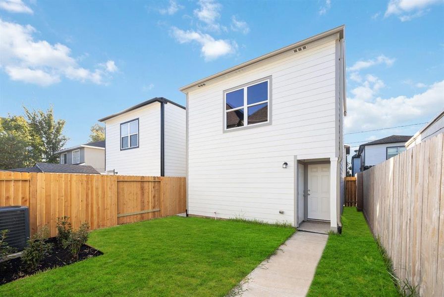 Picture endless outdoor activities in this beautifully fenced and sodded backyard with a view of a freestanding garage. The second story offers additional space, perfect for storage or an available garage apartment upgrade.