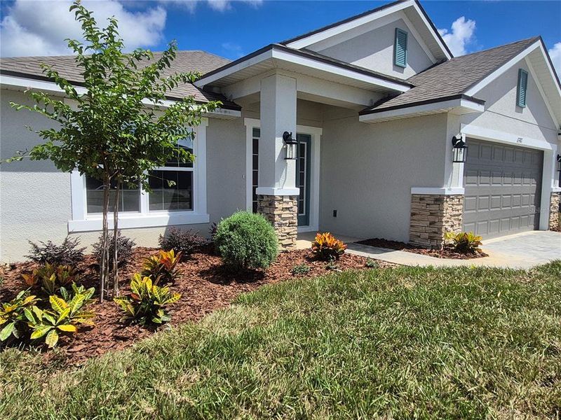 Front exterior of a new home in Abbey Glen, Dade City, FL, highlighting curb appeal (Image 16).