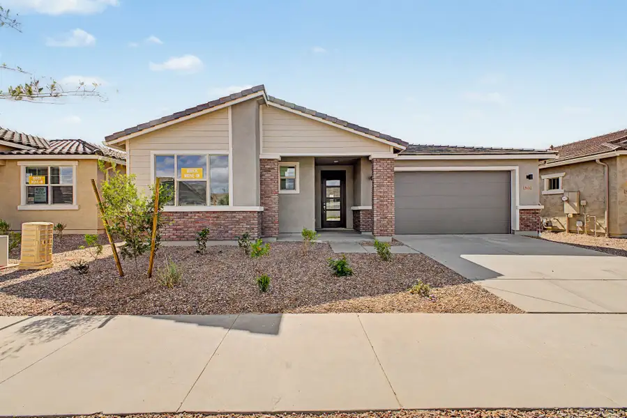 Front exterior of a new home in Empire Pointe, Queen Creek, AZ, highlighting curb appeal (Image 1). Front exterior of a new home in Empire Pointe, Queen Creek, AZ, highlighting curb appeal (Image 1).