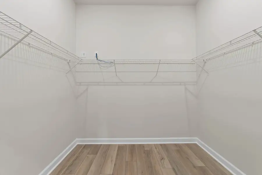 Primary Walk-in Closet Primary Walk-in Closet