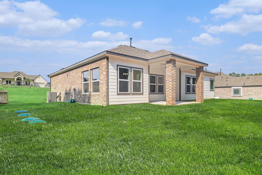 Exterior details and patio area of a home in Rose Hill Estates, Willis (Image 19). Exterior details and patio area of a home in Rose Hill Estates, Willis (Image 19).