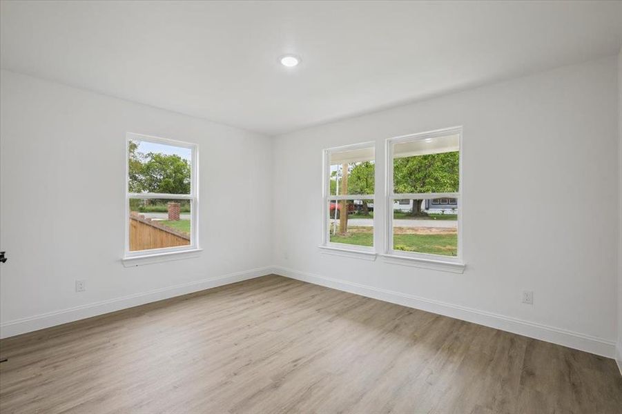 Spare room featuring light wood-style flooring and recessed lighting Spare room featuring light wood-style flooring and recessed lighting