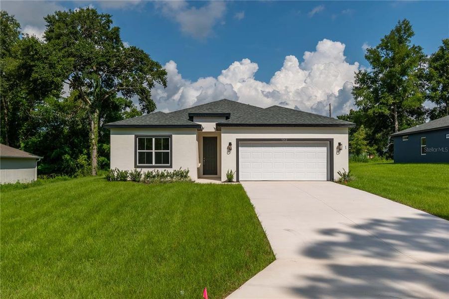 Front exterior of a new home in , Citrus Springs, FL, highlighting curb appeal (Image 21).
