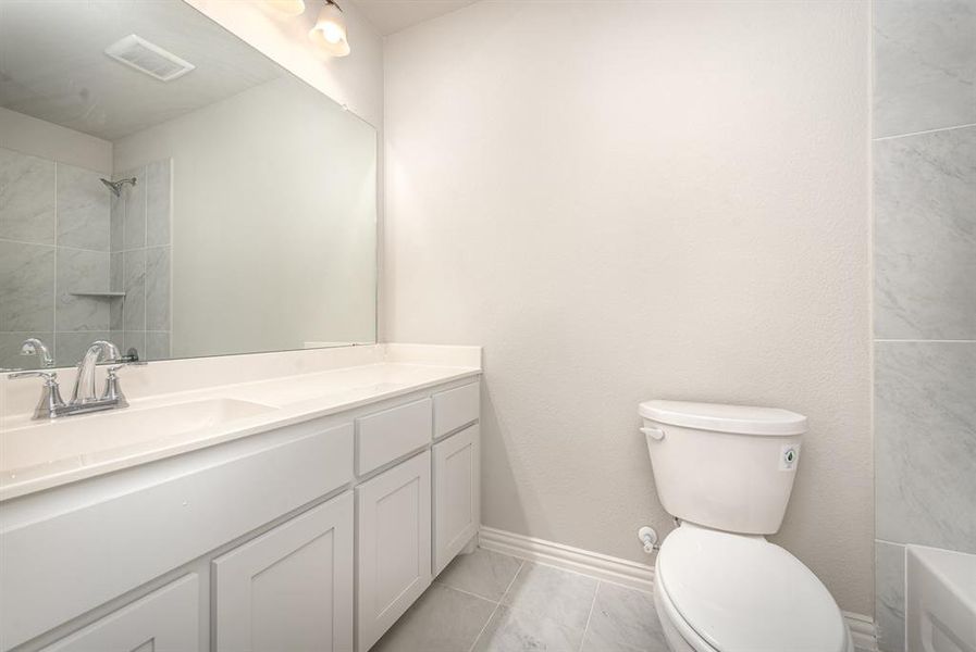 Bathroom with vanity and toilet