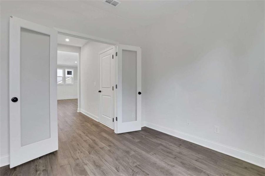 Spacious, unfurnished interior of a new home in The Paddocks at Doc Hughes, Buford (Image 37).