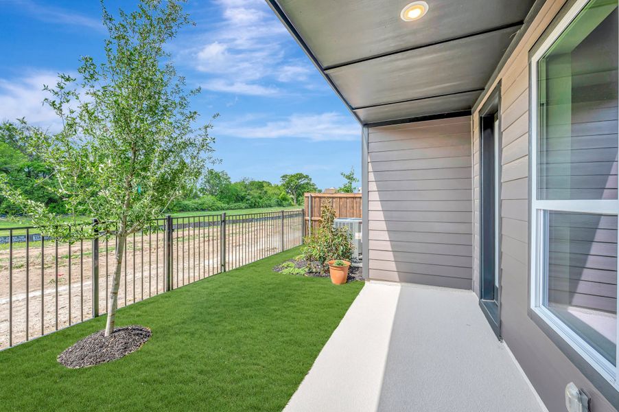 Exterior details and patio area of a home in Trails at Waterside - Villas Series, Fort Worth (Image 4).