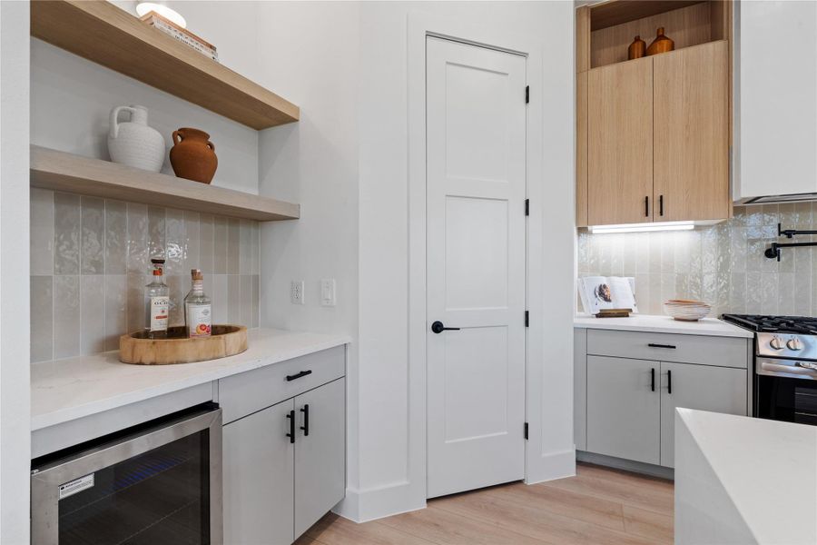 Designed with precision and restraint, the kitchen balances storage, prep, and gathering zones within a streamlined footprint that supports daily living at scale.