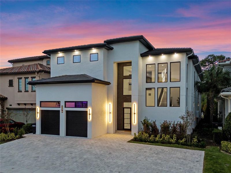 Front exterior of a new home in , Reunion, FL, highlighting curb appeal (Image 21). Front exterior of a new home in , Reunion, FL, highlighting curb appeal (Image 21).