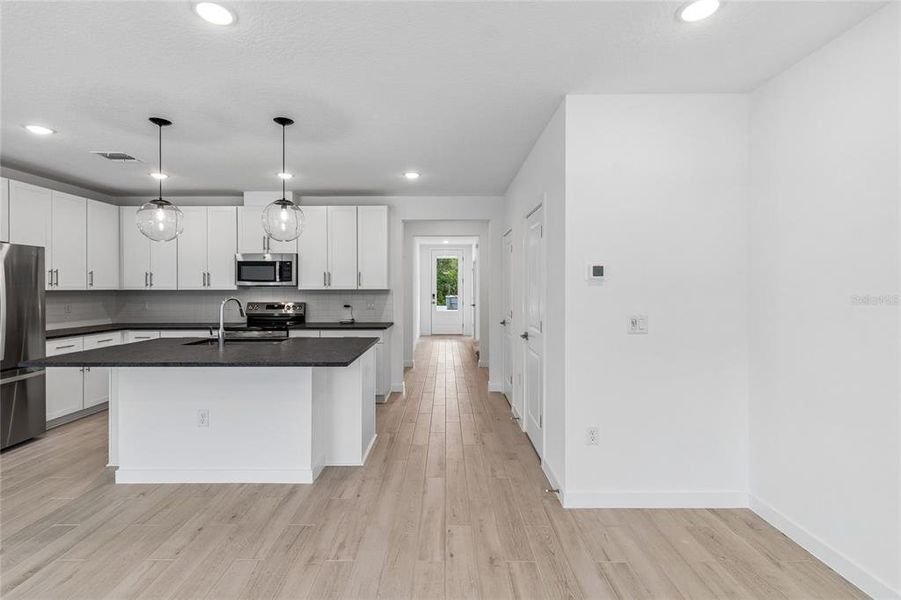 Furnished interior view inside a new home in Aspire at Canter Creek, Davenport (Image 12).