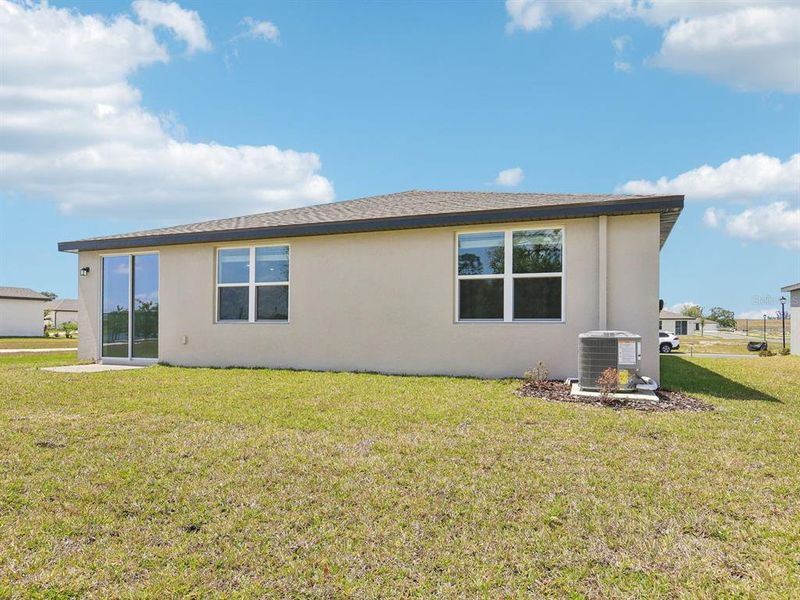 Exterior details and patio area of a home in The Reserve at Van Oaks, Auburndale (Image 4).