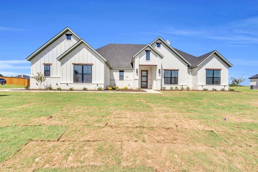 Front exterior of a new home in , Waxahachie, TX, highlighting curb appeal (Image 17).