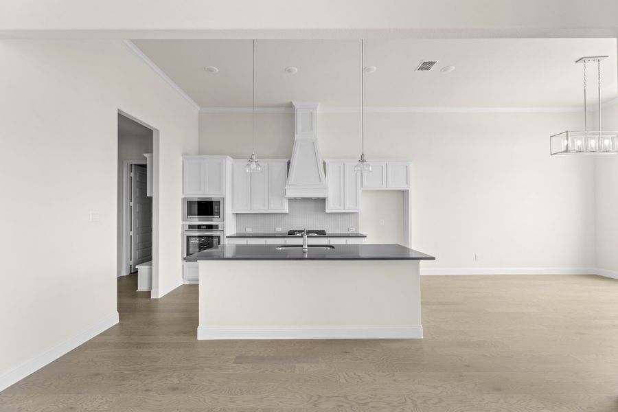 Representative furnished interior of a home built from the Wildwood SE by Sandlin Homes in Settler's Glen, New Fairview (Image 8).