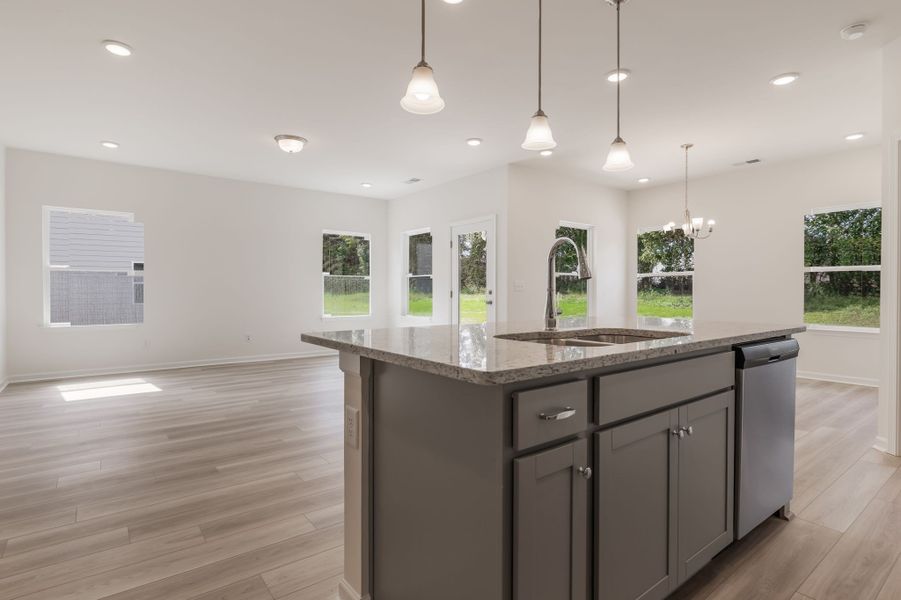 Large kitchen island looking over the open living area.