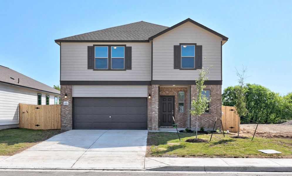 Front exterior of a new home in Overlook Ranch, Georgetown, TX, highlighting curb appeal (Image 19). Front exterior of a new home in Overlook Ranch, Georgetown, TX, highlighting curb appeal (Image 19).