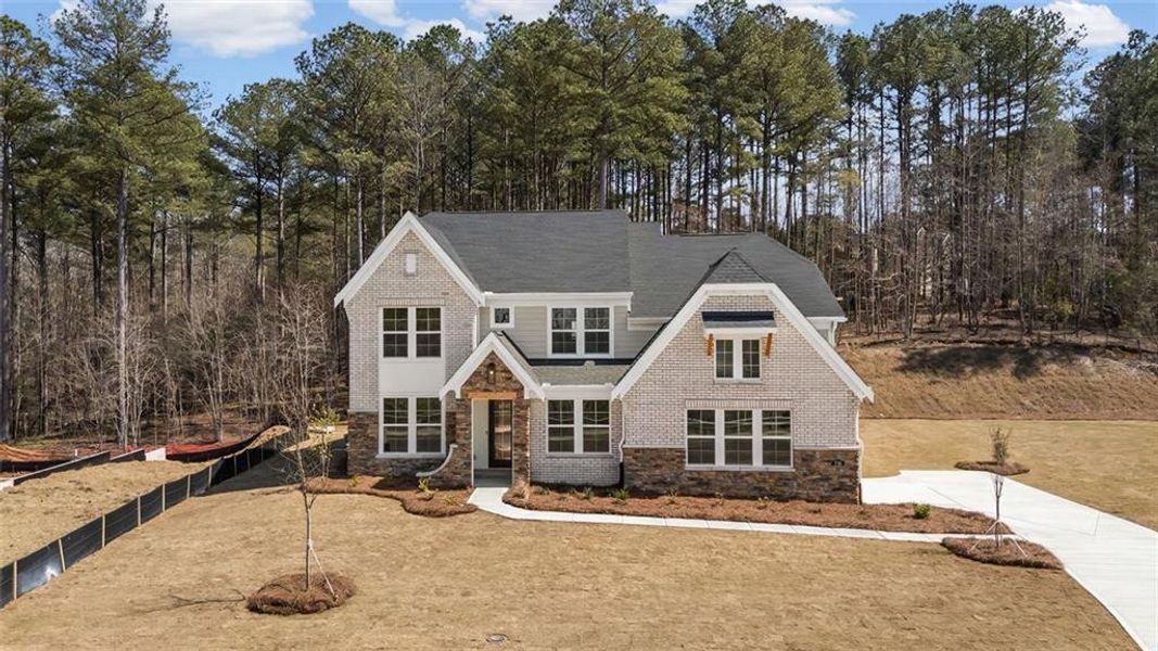Front exterior of a new home in Governor’s Preserve, Canton, GA, highlighting curb appeal (Image 25). Front exterior of a new home in Governor’s Preserve, Canton, GA, highlighting curb appeal (Image 25).