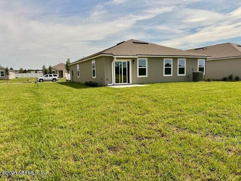 Front exterior of a new home in Rookery, Green Cove Springs, FL, highlighting curb appeal (Image 9). Front exterior of a new home in Rookery, Green Cove Springs, FL, highlighting curb appeal (Image 9).