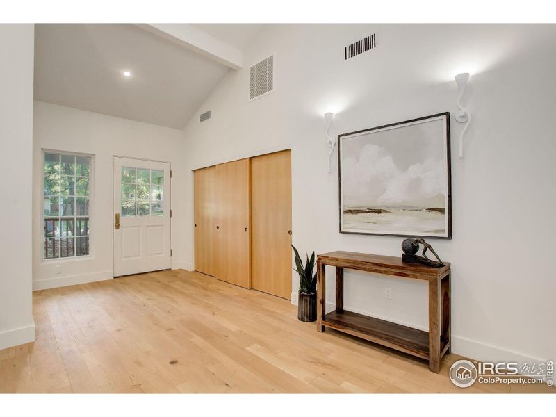 Foyer - showcasing the solid white oak interior doors and wire brushed hardwood floors.